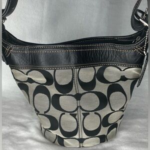 Coach shoulder bag. Black leather with khaki canvas Coach logo design.